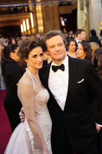 Colin Firth và vợ trên thảm đỏ Oscar. Ảnh: AFP.