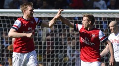Arsenal's Mertesacker celebrates scoring against Fulham during their English Premier League soccer match in London