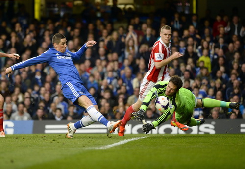Stoke City's Begovic saves a shot from Chelsea's Torres during their English Premier League soccer match at Stamford Bridge in London