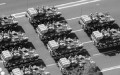 Chinese People's Liberation Army (PLA) armoured vehicles rumble past Tiananmen Square during the National Day parade in Beijing on October 1, 2009. China celebrated 60 years of communist rule with a massive military parade and elaborate pageantry on Beijing's Tiananmen Square showcasing the nation's revival as a global power.  CHINA OUT AFP PHOTO (Photo credit should read STR/AFP/Getty Images)