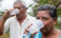Two people drink water from the water supply system in Bella Vista, Las Lomas, province of Cocle, Panama. Photo: Gerardo Pesantez / World Bank