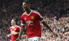 Manchester United's Marcus Rashford, runs to celebrate with teammates after scoring his sides second goal of the game during the English Premier League soccer match between Manchester United and Arsenal at Old Trafford Stadium, Manchester, England, Sunday, Feb. 28, 2016. (AP Photo/Jon Super)