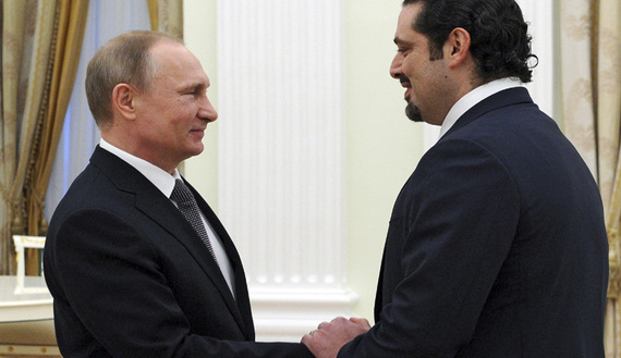 Russia's President Vladimir Putin (L) welcomes Lebanon's former prime minister Saad al-Hariri during a meeting at the Kremlin in Moscow, Russia, April 1, 2016. REUTERS/Michael Klimentyev/Sputnik/Kremlin ATTENTION EDITORS - THIS IMAGE HAS BEEN SUPPLIED BY A THIRD PARTY. IT IS DISTRIBUTED, EXACTLY AS RECEIVED BY REUTERS, AS A SERVICE TO CLIENTS. - RTSD5XC