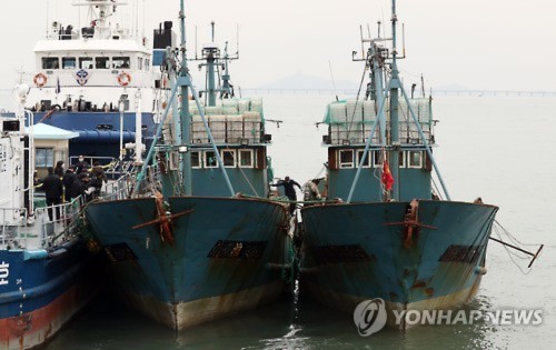 Two Chinese fishing boats, which were seized while illegally fishing in South Korean waters in the West Sea, arrive in the port of Incheon, west of Seoul, on Nov. 2, 2016. South Koreas Coast Guard fired warning shots with an M60 machine gun to capture the vessels earlier in the day.