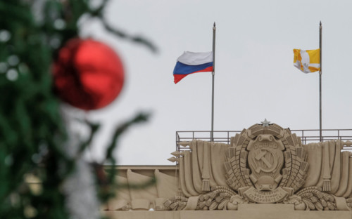 [Caption]National and Stavropol region (R) flags fly at half mast to commemorate passengers and crew members of Russian military plane, which crashed into the Black Sea on its way to Syria, next to a decorated New Year fir tree set in front of at a regional government building in the southern city of Stavropol, Russia, December 26, 2016.