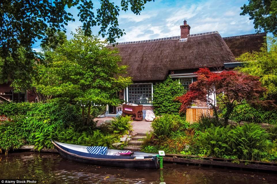 The colourful houses look like something out of a story, with vibrant plants and bushes decorating the exterior of the homes